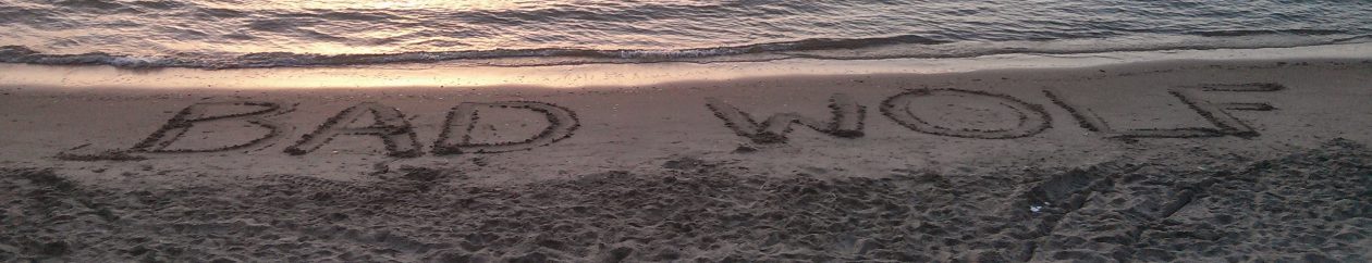 Bad Wolf written in the sand on a beach